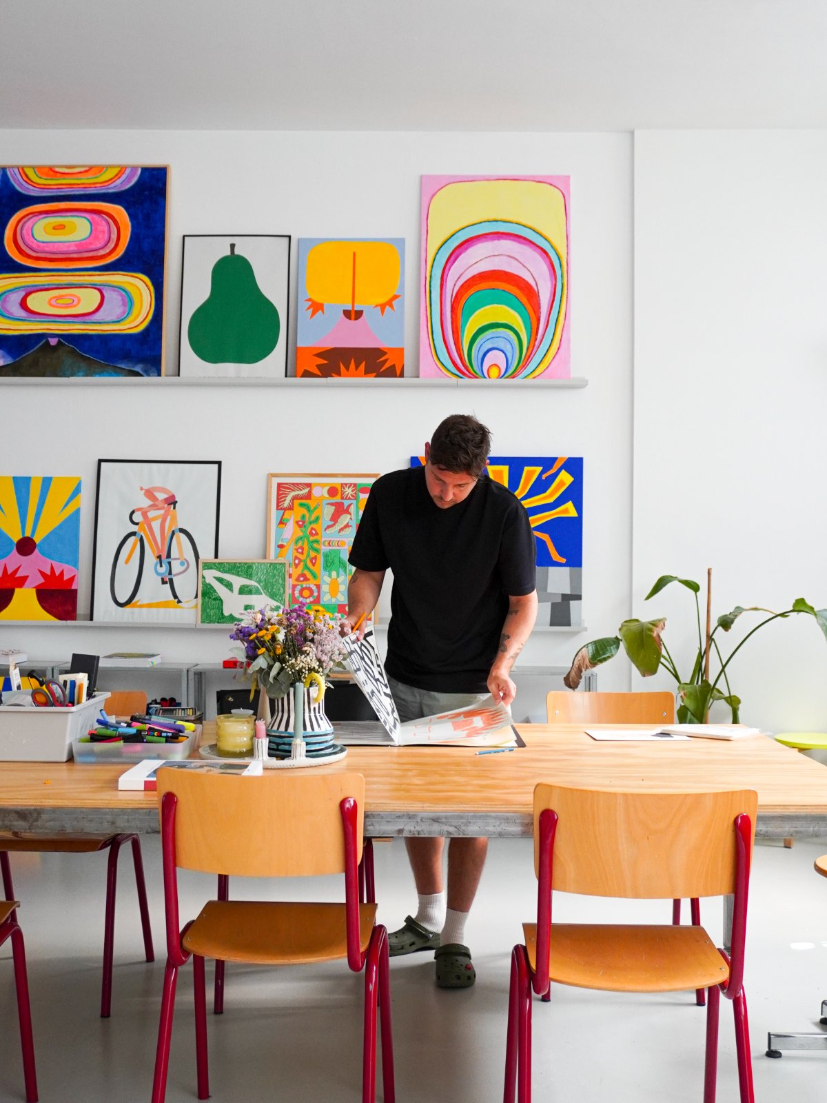 Looking through a portfolio at the studio table